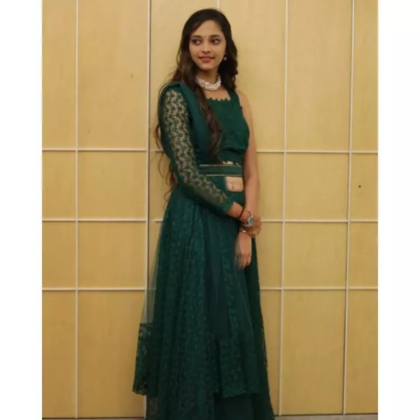 "Emerald Elegance: Green Designer Choli with Lehenga & Belt" on rent