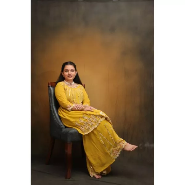 "Radiant Sunshine: Yellow Sharara Haldi Outfit"
 on rent