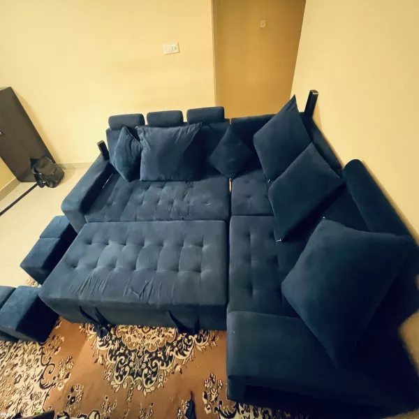 7 Sweater Sofa Cum Bed + 4 Seating Puffies + 6 Cushions on rent