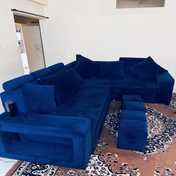 7 Sweater Sofa Cum Bed + 4 Seating Puffies + 6 Cushions on rent