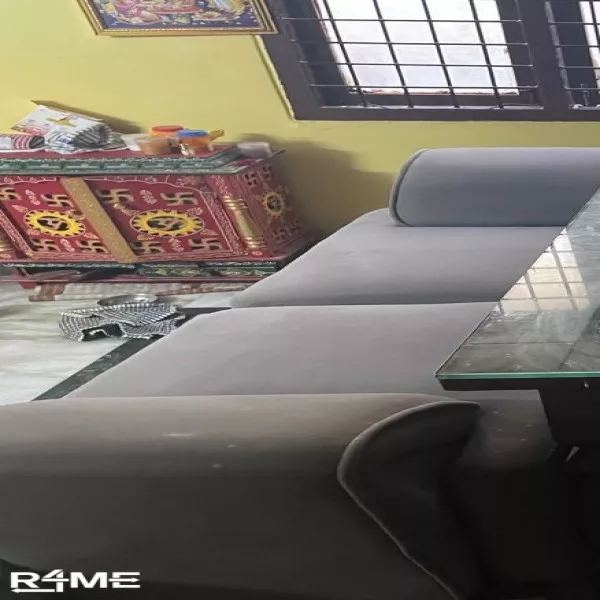 A two seater divider/couch with handrests on rent