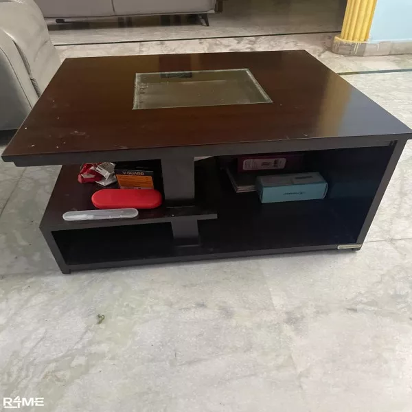 A year old Coffee table with racks on rent