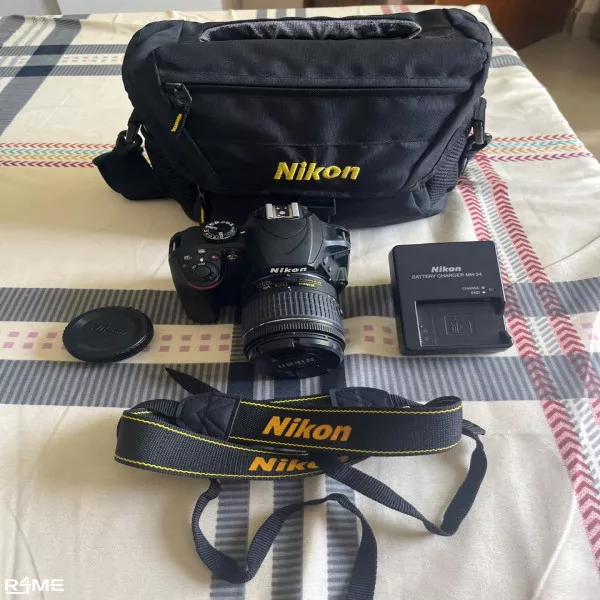 Nikon D3400 Digital Camera and National Geographic tripod. on rent