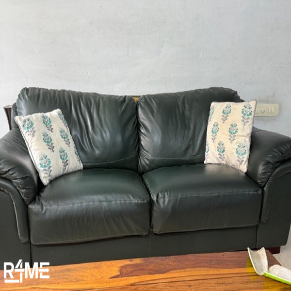 green color sofa single piece space for three on rent