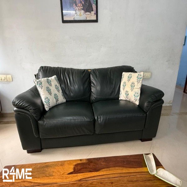 green color sofa single piece space for three on rent